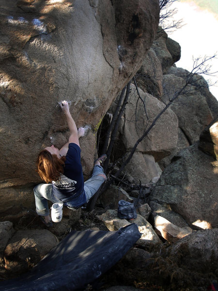 Luke Childers seeing through "The Greater Illusion (V8)" for the first ascent.