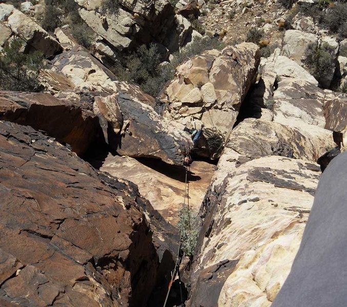 Looking down at the belay ledge from above the bulge.