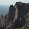 Does anyone know anything about these spectacular towers, if there are any routes on them or if it is even legal to climb on them?  They are not that far above Baboquivari camp.   