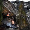 Jason Baker squeezing and pulling to gain the final exit (crux) moves on "Stanley Kubrick (V11)." <br>
<br>
Spotter:  Tom<br>
<br>
Photo by:  Luke Childers