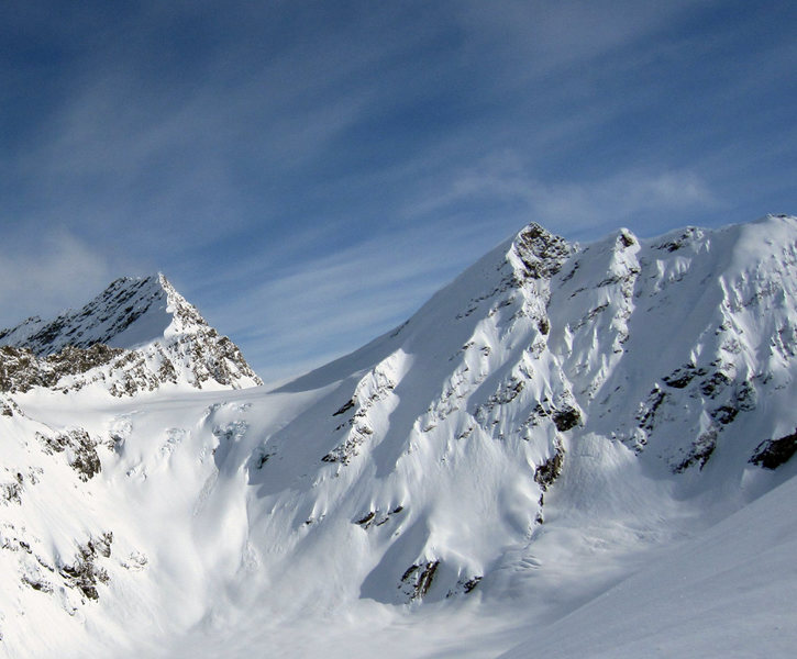 This is a ski run in the Chugach called "Hot Tubs & Beers".  It goes down the shadowed ramp down and left from the peak in the center of the photo.  45 degrees for 2500 vertical.  