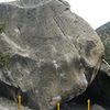 The west face of the main boulder at the Warm-Up Area.