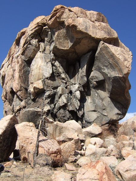 Battlement Crag, the black, concave chimney of In the Line of Fire visible at midheight.