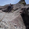 Placing gear in the crux corner.<br>
Photo: Roth.