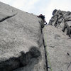 First Ascent with Shingo pulling the slab rockover with just a slung chicken head to protect the move.