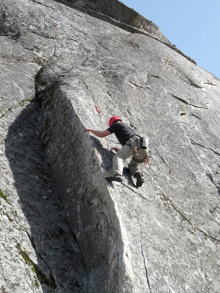 The first crux is mantling at the first bolt. 