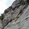 Climbing up to the belay below the roof.