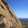 Climber on top of first pitch on Ewephoria.