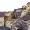 S. Giffin stems up the wide section on pitch 5.  Airy and exposed, but good holds and fun climbing.