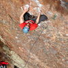 The upper part of the route is quite sustained for the grade but extremely well chalked holds help make quick decisions.  Hunter S on the route, May 2010. 