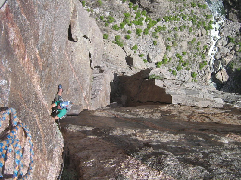 Looking down the upper part of what we climbed as P2, a 70m pitch from the middle of the lower dihedral, through the roof, and up some corners above.  <br>
<br>
There's a more comfortable belay 30m below me, directly above the chimney's roof, but from this belay, a small, pegmatite flake, you can climb through the finger crack and "classic dihedral" to an awesome ledge in a stellar 70m pitch.