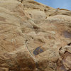 Tele photo of the top 5.10 pitch on the first ascent. Photo Mike Kinney