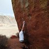 Jared LaVacque, enjoying a break between storms, on Ghost Dance V7,  Matthew Winters park, CO