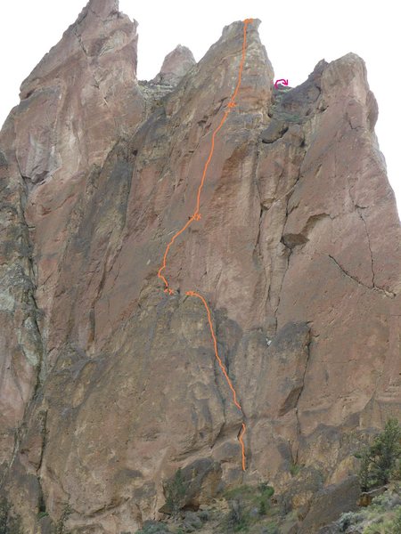 It's hard to get the exact line from this angle, particularly the anchor atop the 10a third pitch, but it's close.<br>
The pink arrow gives a very approximate location for the descent rappel.