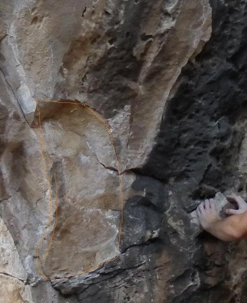 Orange outline shows where the rock has broken off.  Rock contained key holds to routes 1-3 in beta photo 1-Fading 2-Red to Blue 3- BMW. <br>
You can compare the rock to the action photo in One-Leg wonder.(One-Leg wonder looks intact) 