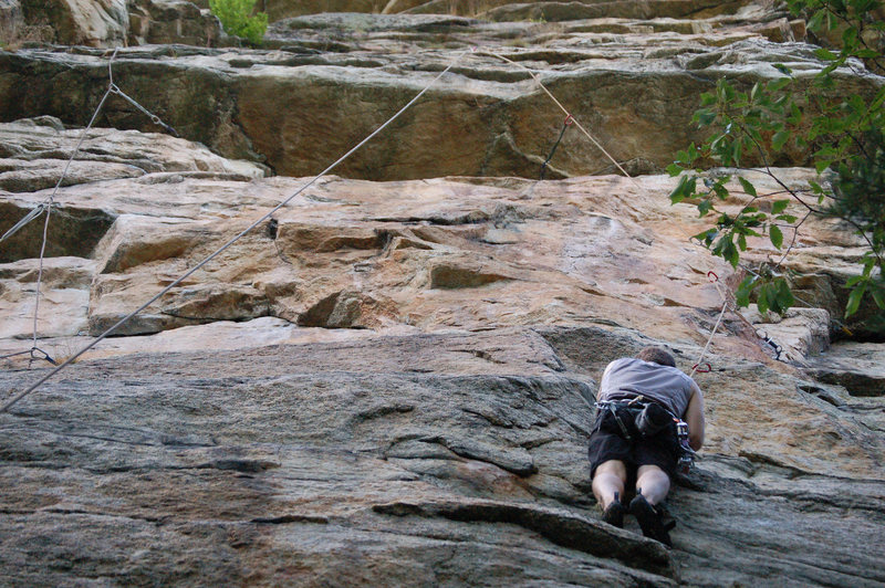 Kevin at the top of the initial crack.  The rope is going through the direct variation at the top.  The regular finish is to the left, where the Graveyard Shift rope is in the photo.