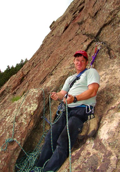 Robert at the top of pitch 2 happy to have good cracks to make an anchor with. 