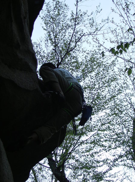 Pulling the crux mantle<br>
Photo by Jim Dickson