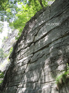 The first pitch of Columbia, which follows the obvious crack that goes up and then arches to the right.  The climb is really well protected, but watch out for the loose block I've highlighted in the photo.  