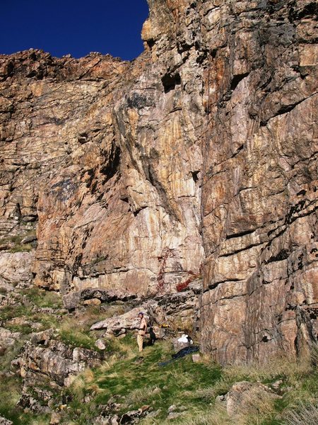 Climbs the arete above the ropebag in the center of the pic.  Look close and you can see the blue rope.