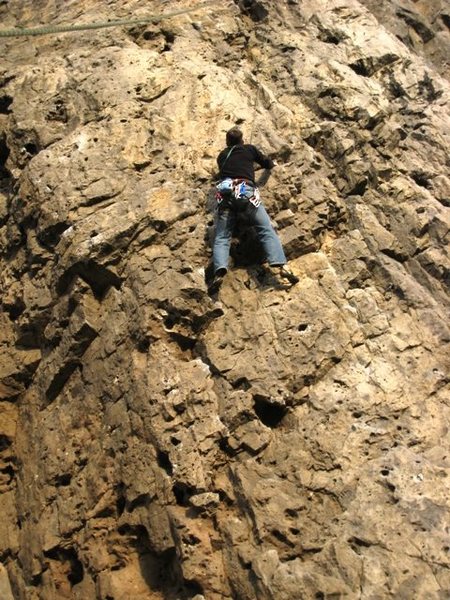 Nearing the top of the overhanging section on the first pitch of Le Cosmos