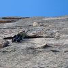 Looking up at the "half circle".  Great 5.10 finger locks to pull over the roof.  