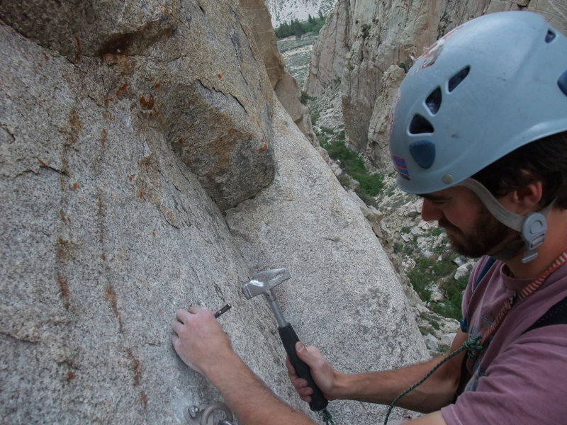 When your drill runs out of batteries, sometimes you gotta get all Warren Harding up in it!  Vic Lawson drilling the last bolt on the last rap with only the bit.