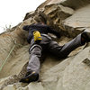 James pulling small roof crux on Holy Crap.