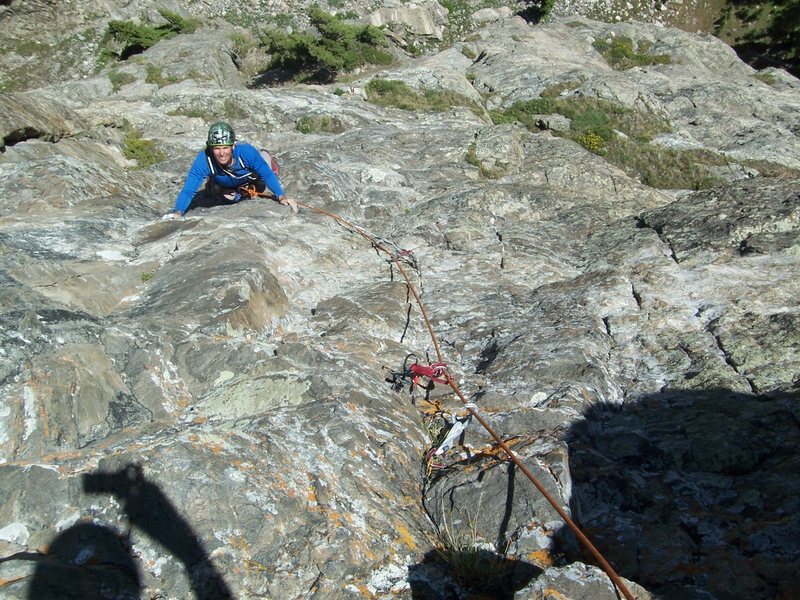 Bert is following the "scary" traverse pitch.  There is good gear at your feet for the hard moves.