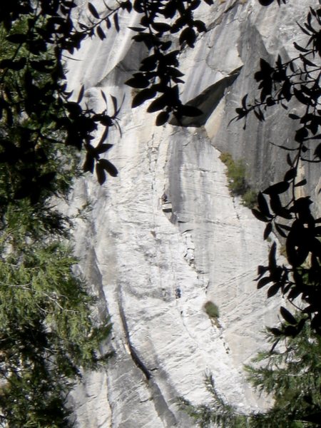 Two people on the penultimate pitch of super slide, viewed from the ground.