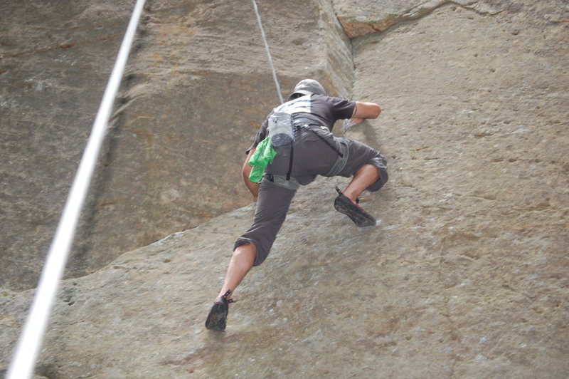 Ashley Holmes working on the crux moves on "Stonyman' 5.12a