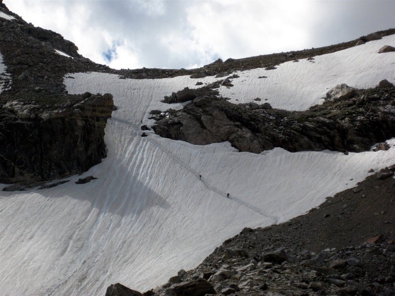 Headwall dividing the Moraine campground from the Lower Saddle.  The "fixed rope" would be on the right side, but at the end of July climbers are still crossing the headwall up the snow -- an ice axe is definitely recommended. (Photo credit:  Dave G)