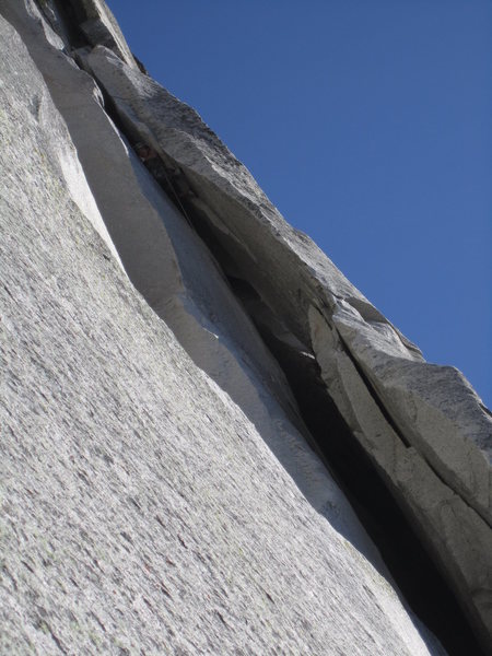 Committing to the 5.9 optional free variation squeeze at the first of the chimney pitches.  whoa nelly, HARD.  No pro.  I recommend taking either of the two alternates.