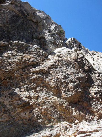 The start from the top of the notch as described above.  You can see a small crack on the left that will take a piece but other than that not many pro options.  The two left facing walls in the sun are the 30' cracks described by Nelson.