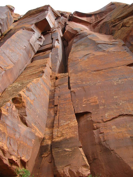 The route goes up the right side of the block in the middle of the photo and into the shadowed slot above.  Buttercup is the splitter on the left side of the photo.