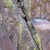 Area of the first crux getting established on the right shelf. This is all overhanging.