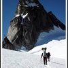 Climbers En Route to the East Creek Bivy with Pigeon Spire in the Background