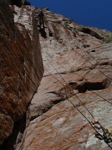 Looking up at the curving corner of the second pitch with MattL working on the top bit.