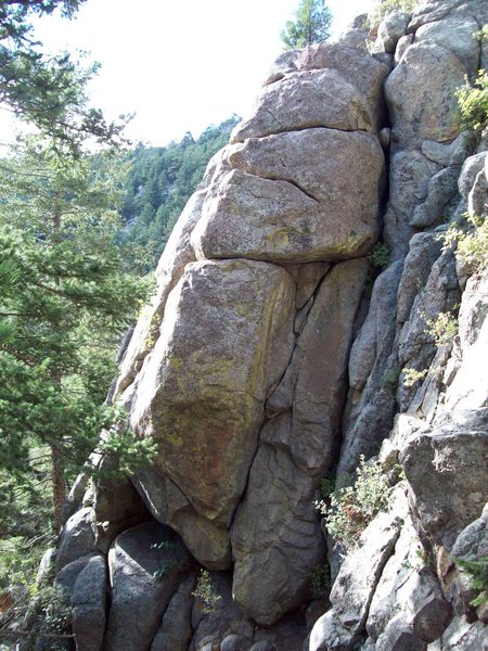 This is actually a picture of Cow Patty Crack. Mr. D'Antonio got it mixed up with Salisbury Steak Crack in his quality new guidebook. Salisbury is the obvious boulder problem handcrack through the bulge on the main face(facing westerly) and Cow Patty is around the corner to the right and up hill. Too bad they are both are not longer or they wold both be much more fun climbs!!!