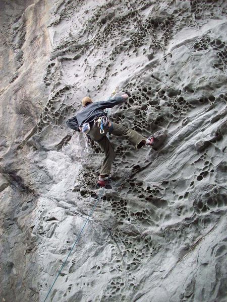 Humboldt Current (5.10a) with first bolt clipped. August of 2010, very sandy holds, had to be swept repeatedly for decent grip. All the lead bolts are showing corrosion, but anchors are nice s/s glue-ins.