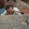 Nathan on the hardest problem on this boulder.