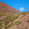 The moon sets over Bloody Mountain at the start of a new day.