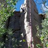 Contemplating the crux moves to reach the anchor.