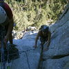 Agina arriving at pitch one belay.