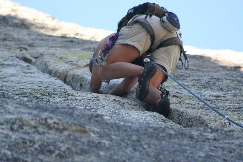 Agina into the fun crack climbing of pitch two.