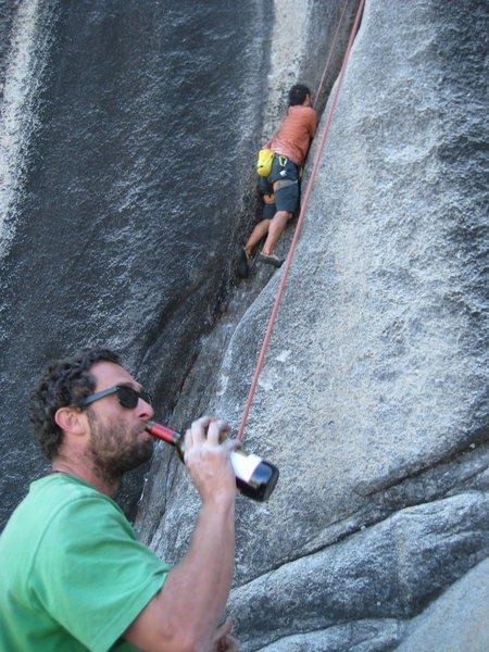 Lord Merlot? Jose gives Mauricio the Two-buck Chuck belay.