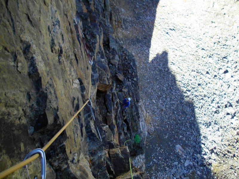 Lookin' down on rog mid way up the second pitch. Rog is belaying from the ledge about a couple hundred off the deck. The gear is good, if the rock is good, but the rock is questionable in places.