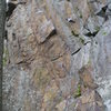 Bootie and Hoefish,View from looking from the gully downhill. The route is to the left of 3 bolts on "orange tinted left slanting rock" usually chalked. Anchors at top.