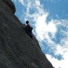 Unknown climber on the nicely exposed 5.9 crack that splits the ridge.