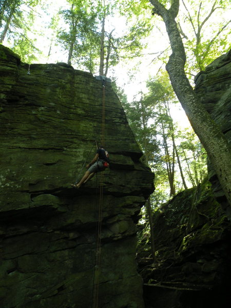 Spencer cleaning the holds on Temptation (5.11a)